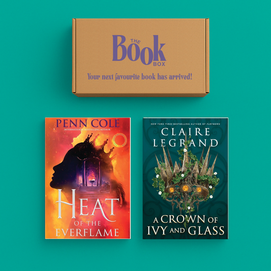 Romantasy Book Subscription Box with fantasy romance novels in a cozy, magical setting.